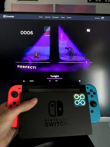 PixelPizza holding the Nintendo Switch in front of Tonight on the monitor